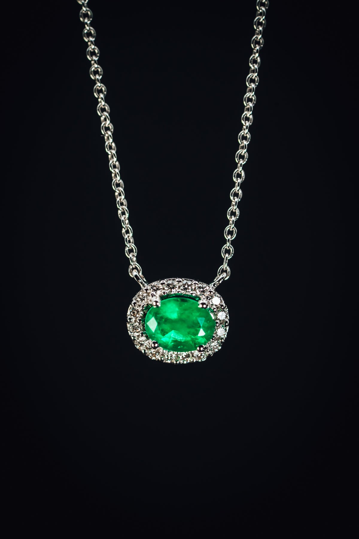 14k White Gold Emerald and Diamond Halo Pendant