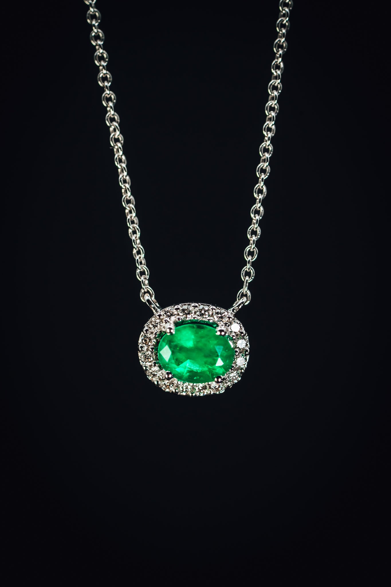 14k White Gold Emerald and Diamond Halo Pendant