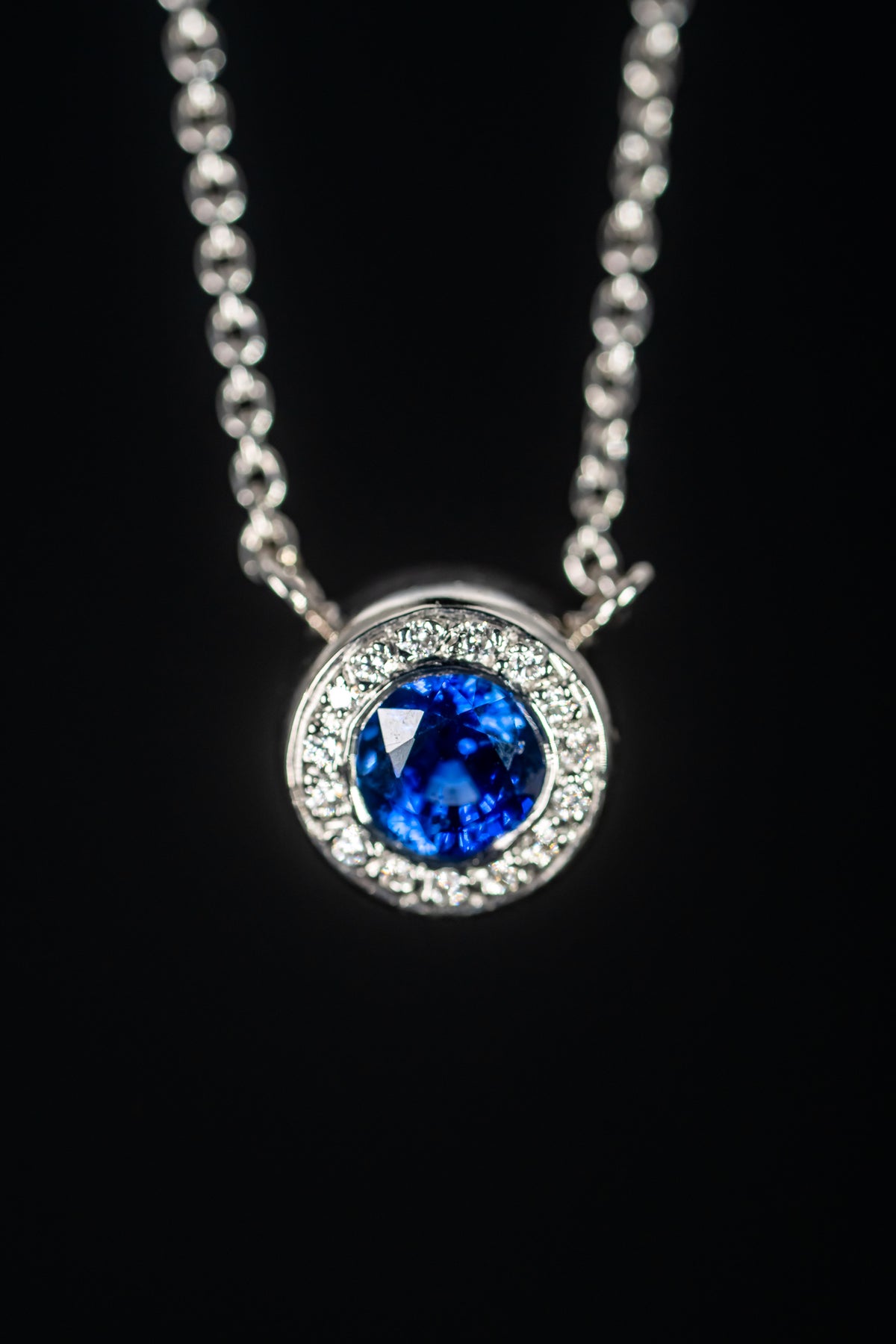 Platinum Blue Sapphire and Diamond Halo Necklace