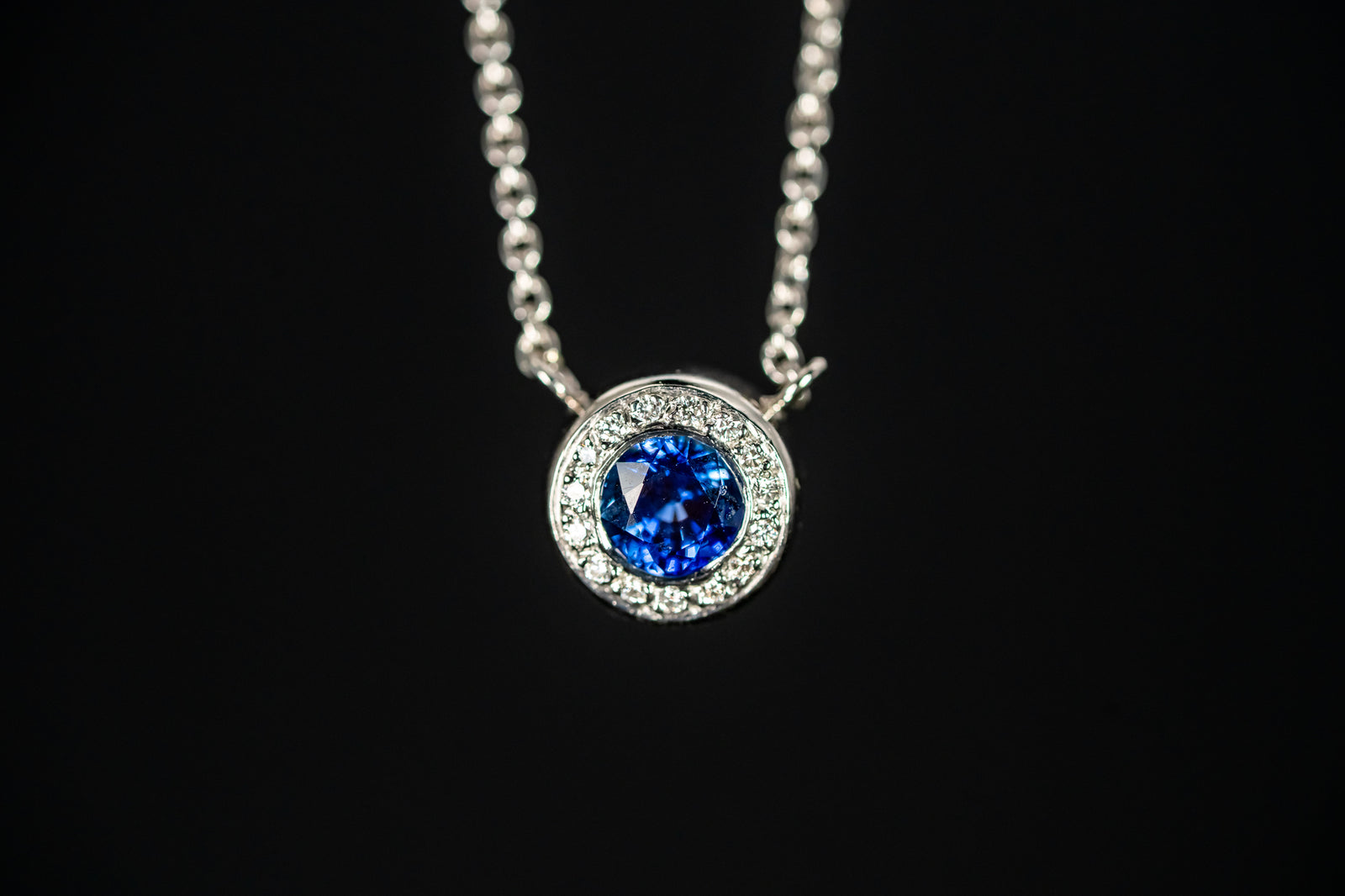 Platinum Blue Sapphire and Diamond Halo Necklace