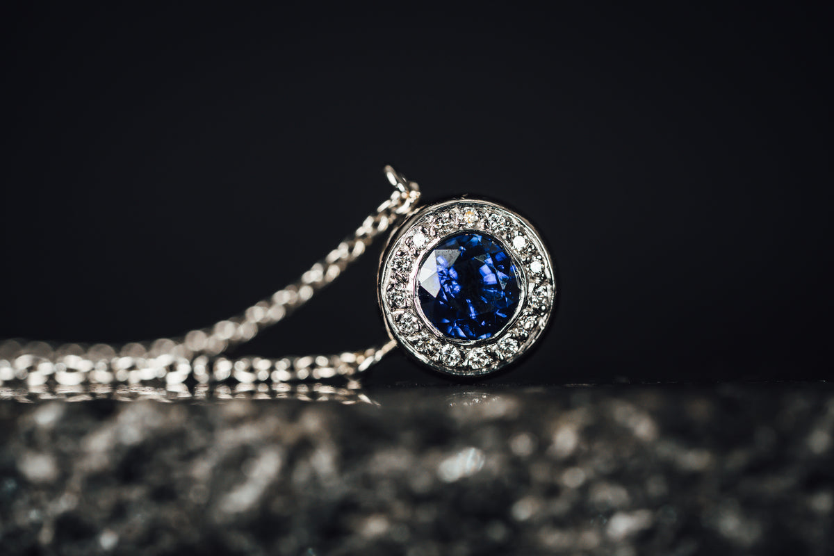 Platinum Blue Sapphire and Diamond Halo Necklace