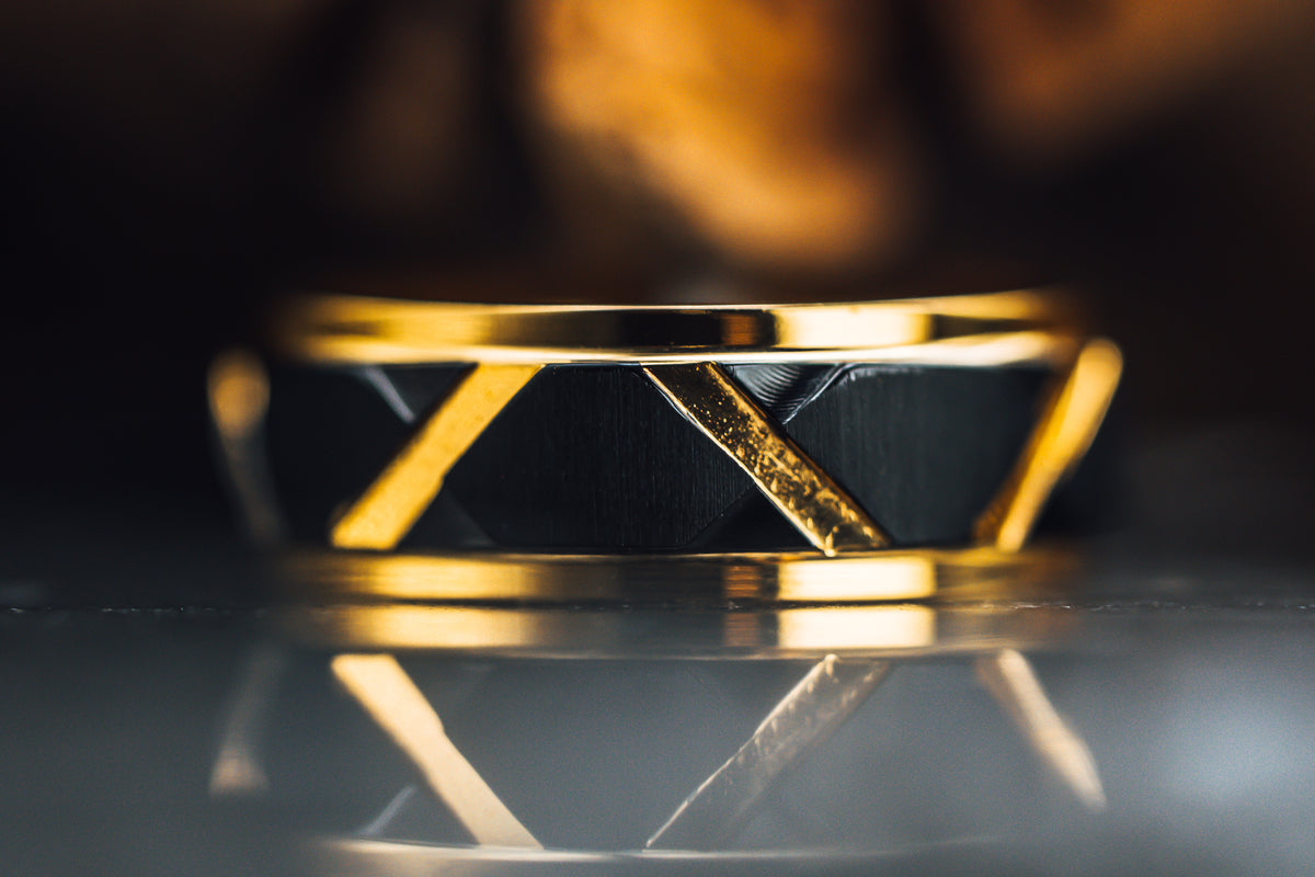 Yellow Gold Plated Flat Polished Step Edged Titanium Men&#39;s Wedding Band With Matte Black Raised Horizontal Etches and Gold-Plated Diagonal-Shape Cut Inlay