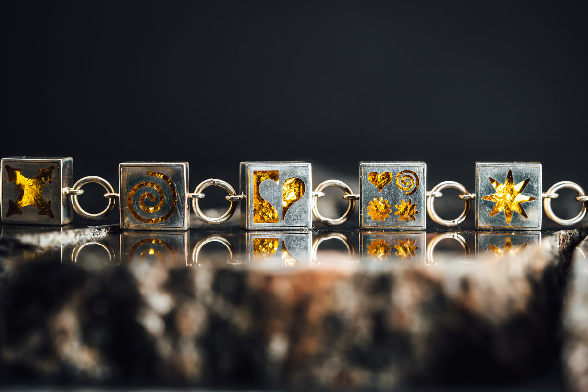 Sterling Silver Symbols Bracelet w/Gold Leaf Inside